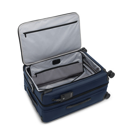 TUMI - Alpha Medium Dual Access Expandable 4-Wheeled Checked Luggage - Zipper Expansion - Durable Ballistic Nylon - Medium Capacity Suitcase with TSA Lock - Navy